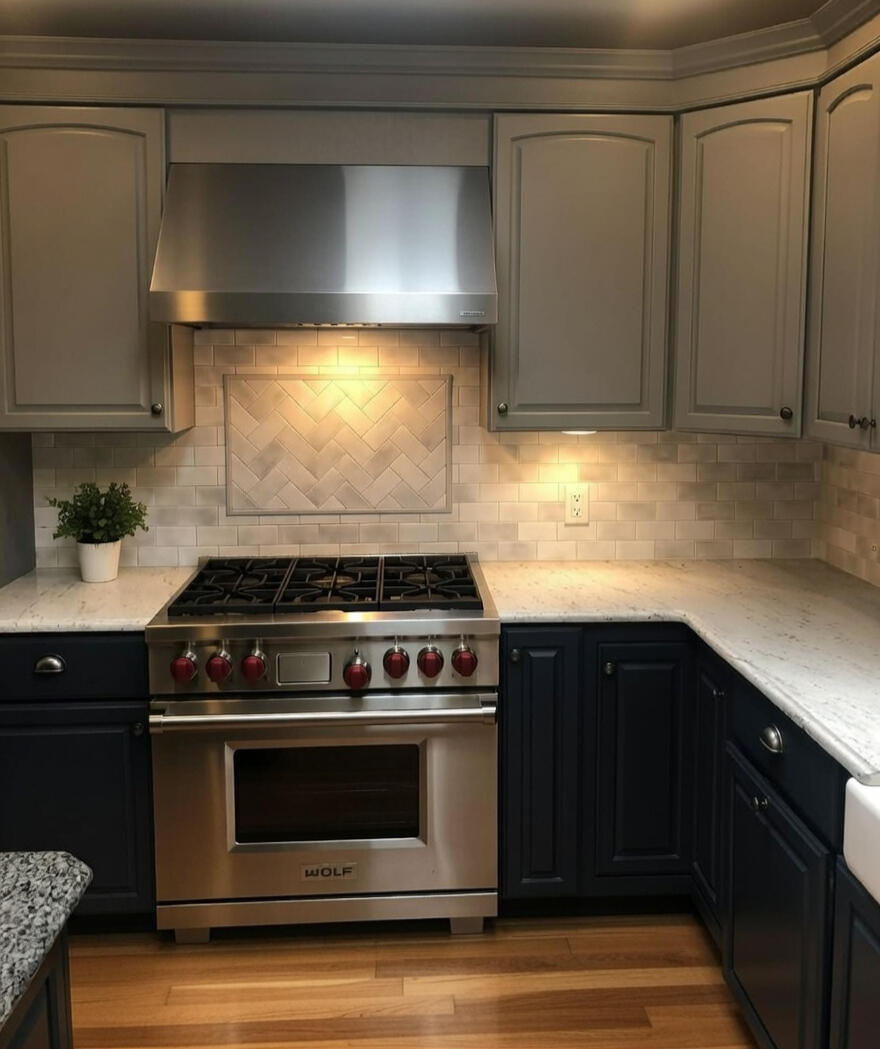 Classic Subway Tile Backsplash with Focal Panel of Custom Pencil Framed Herring Bone Inlay
